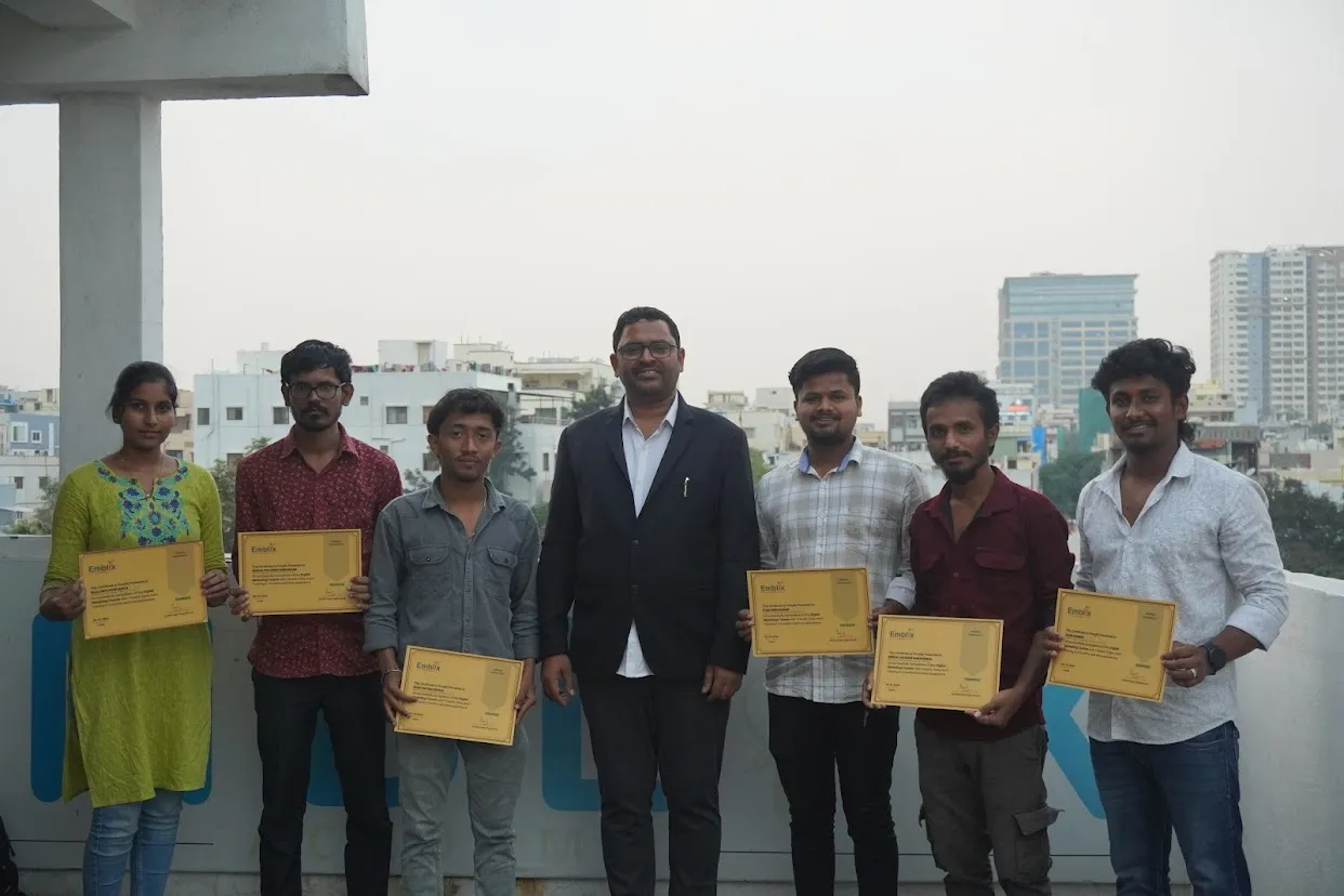 Student holding a completion certificate at Emblix Academy